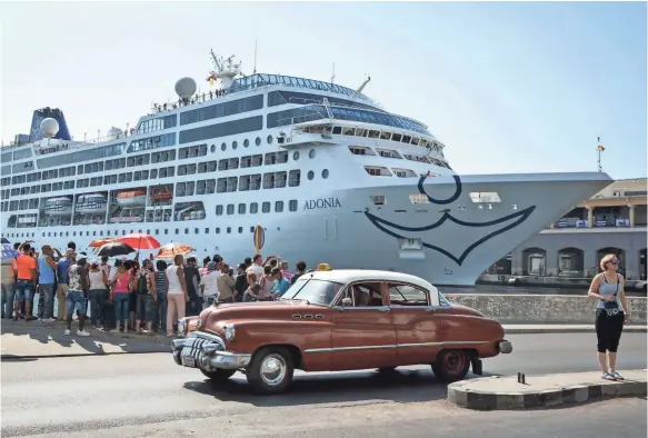  ?? JORGE BELTRAN, AFP/GETTY IMAGES ?? The first USA-to-Cuba cruise ship to arrive in the island nation in decades remains docked at the port of Havana Monday.