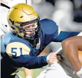  ?? ROB DICKER / DAILY SOUTHTOWN ?? Lemont linebacker Albert Pontrelli (51) goes for a tackle against Hillcrest in 2019.