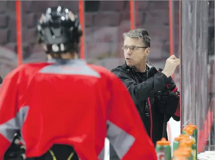  ??  JEAN LEVAC/OTTAWA CITIZEN ?? Head coach Dave Cameron talks to his players during practice at Canadian Tire Centre on Wednesday.