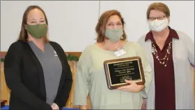  ?? PHOTOS COURTESY OF MMI ?? Sabrina Mcgee and Teagan Lefere of MSU Extension receiving the Community Partner of the Year Award from MMI CEO Cherie Johnson.