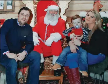  ??  ?? Barry Clarke, Suzanne Kellett and their son Cameron visit Santa at his grotto in Arnott’s, where Barry surprised Suzanne with an early Christmas gift – an engagement ring!
