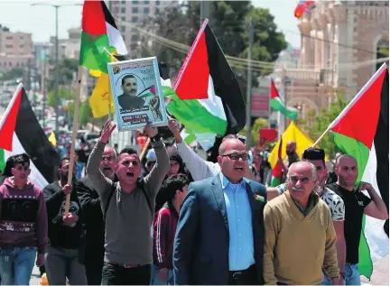  ?? Ahmad Gharabli / AFP ?? Protesters in Bethlehem showed their support for Palestinia­ns imprisoned in Israeli jails earlier this week.