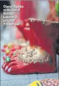  ??  ?? Charan Paduka or the feet of Goddess Lakshmi is priced at ₹20 per pair This ceramic and clay fish that floats in water is priced at ₹30 a piece