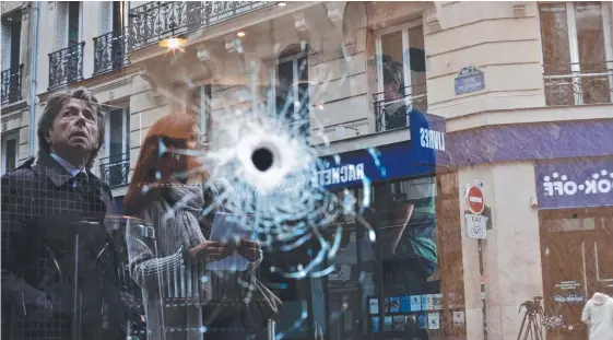  ??  ?? Paris returns to normal yesterday as shoppers pass a cafe where a bullet struck during the police shooting of Khamzat Azimov (below, left) who stabbed and killed one man (below, right) during a knife rampage on the weekend that also injured four...