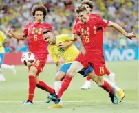  ?? — Reuters ?? Brazil’s Neymar in action with Belgium’s Thomas Meunier and Axel Witsel during the quarterfin­al at Kazan Arena.