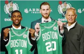  ??  ?? CELTS PRIDE! Ibinida nina Kyrie Irving at Gordon Hayward ang kani-kanilang Celtics jersey.