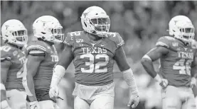  ?? [DANIEL DUNN/USA TODAY SPORTS] ?? Texas' football team has reportedly had 13 players test positive for coronaviru­s.