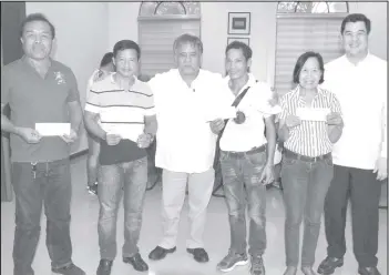  ?? Malihan photo) (Richard ?? A total P2 million were turned over for projects in Sagay City, Cadiz City, Hinigaran, and La Castellana at the Negros Occidental Provincial Capitol yesterday. Among the projects the allocation will fund include improving and expanding a water system, building a fence, acquiring a dump truck, and renovating a barangay hall. Provincial Board Members Salvador Escalante, Jr. (third from left) and Alain Gatuslao (right) were present for the turnover.