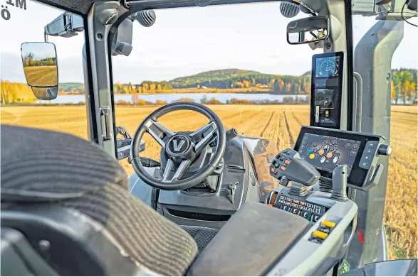  ??  ?? DREAM SCREEN: The cabs of the latest Valtra T series of tractors include a pillar-mounted instrument display in line with the exhaust stack.