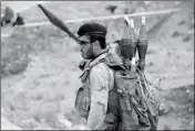  ?? ASSOCIATED PRESS ?? IN THIS APRIL 22 PHOTO, an Afghan national Army stands guard at a checkpoint in the Kabul-Jalalabad highway on the outskirts of Kabul, Afghanista­n.