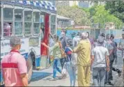  ?? PRATIK CHORGE/HT ?? People wait to board a BEST bus, which is plying only essential services workers, in Bhandup on Monday.