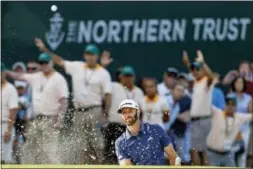  ?? ADAM HUNGER — THE ASSOCIATED PRESS ?? Dustin Johnson hits out of a sand trap on the 17th hole during the final round of The Northern Trust golf tournament on Sunday in Old Westbury, N.Y.