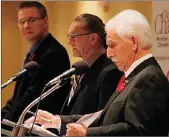  ?? Herald file photo ?? Jukka Laurio is framed by Andrew Jakubeit and John Vassilaki during a 2014 mayoral election forum.