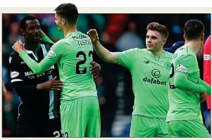  ??  ?? HARD LINES: Efe Ambrose is consoled by former Celtic team-mate Mikael Lustig
