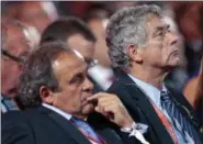  ?? IVAN SEKRETAREV — THE ASSOCIATED PRESS FILE ?? In this Saturday file photo, UEFA President Michel Platini, left, and FIFA vice president Angel Maria Villar Llona attend the preliminar­y draw for the 2018 soccer World Cup in Konstantin Palace in St. Petersburg, Russia. UEFA said Thursday vice...