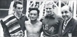  ?? FPG/Getty Images ?? ‘A TRUE GIANT’ Sammy Lee, center, poses with the two other medalists and the U.S. team coach, right, after winning gold in the men’s 10-meter platform diving competitio­n at the 1948 London Olympics.