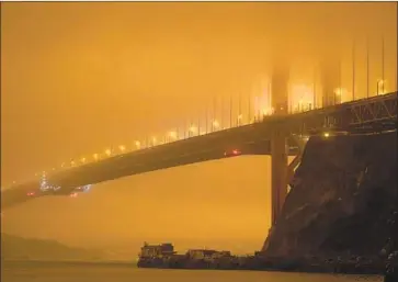  ?? Eric Risberg Associated Press ?? WEALTHY people stuck at home during the pandemic and as wildfires rage statewide want the best air filtration systems money can buy, a luxury real estate agent says. Above, the smoke-shrouded Golden Gate Bridge.