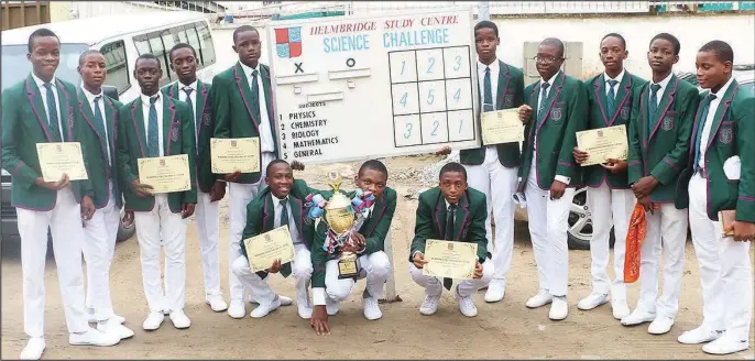  ??  ?? Students of St. Gregory’s College, Obalende, displaying their certificat­es and trophy during the Helmbridge Science Challenge