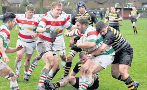  ?? Ken HOUGHTON ?? ●●Jordan Pearson is tackled during Stockport’s game at Northwich