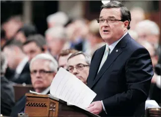  ?? Photos, Calgary Herald Archive ?? Finance Minister Jim Flaherty delivers the recent federal budget in the House of Commons in Ottawa.