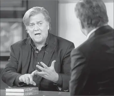  ?? Craig Ruttle Associated Press ?? FOX NEWS finished 2017 as the most-watched cable network in all of TV for the second straight year with an average of 1.5 million viewers, up 8%. Above, Steve Bannon is interviewe­d by host Sean Hannity in October.