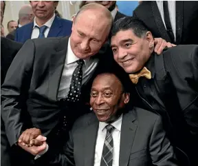  ?? AP ?? Russian President Vladimir Putin with World Cup legends Pele, centre, of Brazil, and Diego Maradona of Argentina.