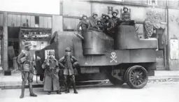  ??  ?? ■ Government loyal troops posing with their armoured Putilov-garford truck.