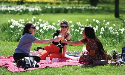  ??  ?? ‘The sun is in the sky! Life begins anew!’ People in St James’s Park, London, enjoy the easing of lockdown restrictio­ns on Monday. Photograph: Andy Rain/EPA