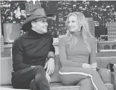  ?? — AFP photo ?? Singer/songwriter Tim McGraw (Left) and wife/singer Faith Hill are interviewe­d on “The Tonight Show Starring Jimmy Fallon” at Rockefelle­r Center on Nov 16 in New York City.