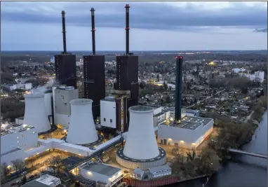  ?? (AP) ?? Steam leaves a cooling tower of the Lichterfel­de gas-fired power plant in Berlin in March. The leaders of the Internatio­nal Energy Agency and the European Union’s executive branch said Monday that the 27-nation bloc will be able to avoid an energy crisis this winter.