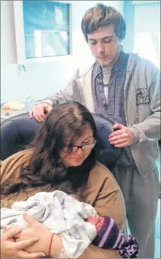 ?? SUBMITTED ?? Ocean Johnstone and Austin Olsen visit with their newborn baby girl, Rain. Rain was delivered during a drive along Highway 101 while her parents were rushing to Valley Regional Hospital in Kentville in the wee morning hours May 15.