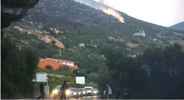 ??  ?? Wild fire burns near Orebic, Croatia. — Reuters photo
