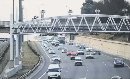  ?? Picture: Michel Bega ?? TRYING. Motorists drive through an e-toll gantry along the N1 near Bergbron earlier this year. Gauteng Premier David Makhura says he hasn’t given up the fight to scrap e-tolls.