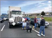  ?? JOSE CARLOS FAJARDO — STAFF PHOTOGRAPH­ER ?? Stuck commuters break out stools to sit as they wait in the gridlock along Interstate 880in West Oakland on Monday.