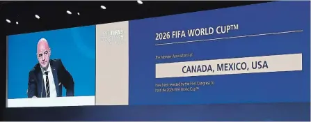 ?? CAO CAN/XINHUA TNS ?? A screen shows Canada, Mexico and the United States winning the joint bid to host the 2026 football World Cup in Moscow, Russia, Wednesday.