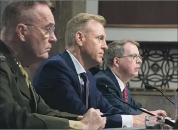  ?? Michael Reynolds EPA/Shuttersto­ck ?? ACTING DEFENSE SECRETARY Patrick Shanahan, center, appeared before the Senate Armed Services Committee on Thursday. The hearing spent more time on the border wall, but his main concern was China.