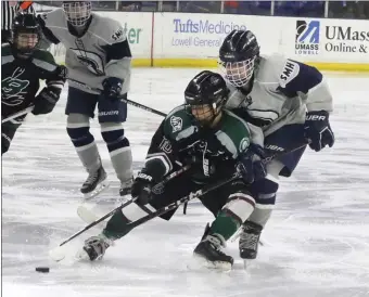  ?? JULIA MALAKIE — LOWELL SUN ?? Billerica/Chelmsford’s Remoré Serra has the inside position on St. Mary’s Katy Sarazen during state tournament girls hockey action Sunday at the Tsongas Center. St. Mary’s was a 6-3 winner.