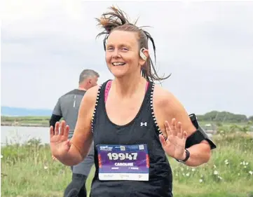  ?? ?? MILES: Caroline Brownlie went from dog walking to running a marathon in five months.