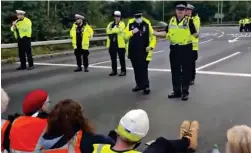  ?? ?? Are you comfortabl­e? Officers address the protesters