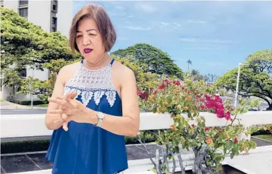  ?? JENNIFER SINCO KELLEHER/AP ?? Purie Ibalio, a hotel housekeepe­r in Honolulu, rubs her aching hands last week. Many hotels across the United States are limiting daily housekeepi­ng service, making what was already one of the toughest jobs in the industry even harsher.