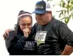  ?? PHOTO: AP ?? Wrestling coach Ray Castellano­s, right, and assistant coach Monique Cabrera mourn at the site where their South El Monte High School athlete Jeremy Sanchez, 17, was fatally stabbed, allegedly by a teenage friend.