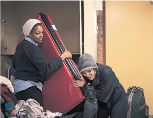  ?? MELISSA RENWICK TORONTO STAR FILE PHOTO ?? Angela Gibson, left, and Ellie Fedak work at the Sistering community centre in Toronto.