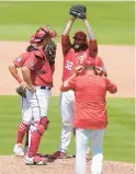  ?? LYNNE SLADKY/AP ?? Nationals starting pitcher Trevor Williams stretches as he’s visited on the mound when the bases were loaded during the fifth inning of a spring training game against the Miami Marlins on Saturday.