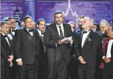  ?? Theo Wargo / Getty Images ?? The cast and crew of “The Band’s Visit” accept the award for best musical during the 72nd annual Tony Awards.