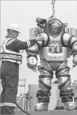  ?? ALEX DECICCIO VIA THE NEW YORK TIMES ?? An archaeolog­ist in the Exosuit, a lightweigh­t suit intended to allow a diver to work for long periods at depths of more than 1,000 feet.