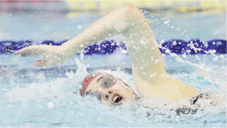  ?? DAX MELMER/FILES ?? Leamington’s Emily Bunda competes in the senior girls 200-metre freestyle event at the provincial swimming meet at the Windsor Internatio­nal Aquatic and Training Centre in February. A potential problem with currents in some lanes affecting times was...