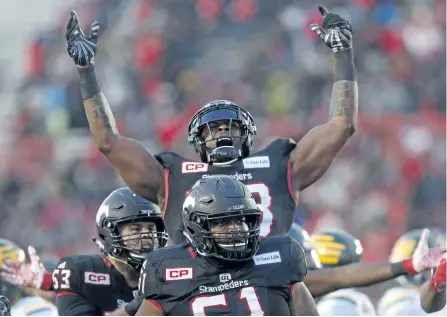  ?? LEAH HENNEL/ POSTMEDIA NETWORK ?? Calgary running back Jerome Messam celebrates his touchdown during the Stampeders’ win over the Edmonton Eskimos Sunday in the CFL Western Final action at McMahon Stadium in Calgary.