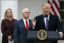  ?? MANUEL BALCE CENETA — THE ASSOCIATED PRESS ?? President Donald Trump speaks during a news conference in the Rose Garden of the White House after meeting with lawmakers about border security, Friday in Washington, Secretary of Homeland Security Kirstjen Nielsen and Vice President Mike Pence listen.