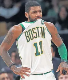  ?? MATT STONE / BOSTON HERALD ?? SOUR TASTE: Kyrie Irving reacts during the second half last night at the Garden as the Celtics lost to the Knicks, 117-109.
