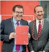  ?? PHOTO: ROBERT KITCHIN/STUFF ?? Labour finance spokesman Grant Robertson and leader Andrew Little unveil Labour’s fiscal plan at the Kilbirnie Medical Centre in Wellington yesterday.